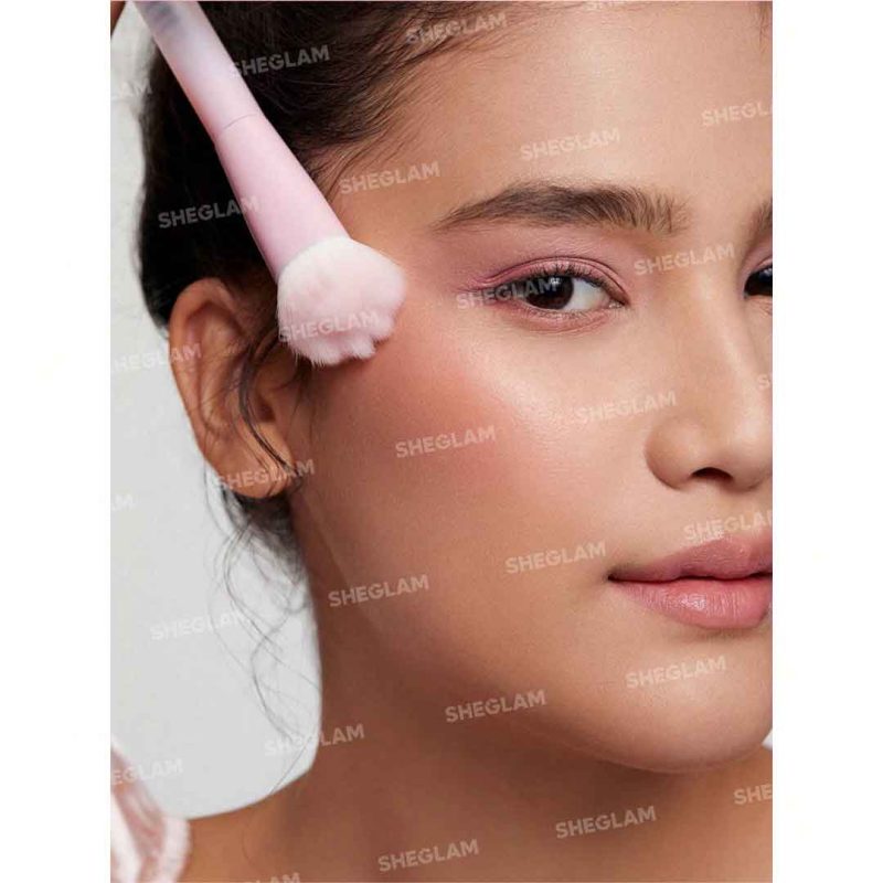 Cat paw brush applying blush on model face light natural color application without harsh marks lifts cheeks for a soft fresh look Sheglam