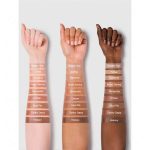 Close-up of Golden Sun liquid contour texture on hand skin; lightweight creamy texture with medium brown warm undertone, ideal for natural highlighting and warming the face without harsh lines