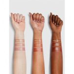 Close up of Ruby lip balm soft glossy texture on hand or lips deep red with warm fruity undertone hydrating gentle gel texture natural shiny finish without stickiness Sheglam