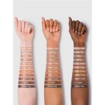 Close-up of Tawny Amber liquid contour on hand skin; dark brown with warm amber undertone, smooth texture, easy to blend, ideal for professional contouring on skin tones