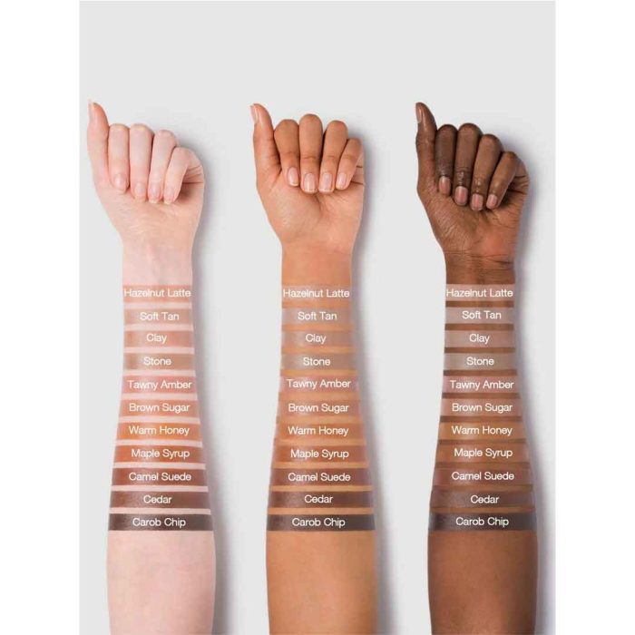 Close-up of Tawny Amber liquid contour on hand skin; dark brown with warm amber undertone, smooth texture, easy to blend, ideal for professional contouring on skin tones
