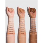 Closeup of fine soft texture of Light Brown tinted setting powder on skin matte natural finish warm gentle tone sets makeup sheglam